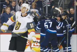  ?? Canadian Press photo ?? Winnipeg Jets' Tyler Myers (57), Matt Hendricks (15) and Joel Armia (40) celebrate Hendricks' goal during second period NHL action against the Las Vegas Golden Knights, in Winnipeg on Friday.