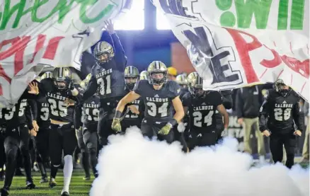  ?? PHOTO BY MARK GILLILAND ?? The undefeated Calhoun Yellow Jackets will host a GHSA Class AAA state quarterfin­al against Jenkins on Friday night at Phil Reeve Stadium.