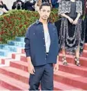  ?? JAMIE MCCARTHY/GETTY ?? Riz Ahmed’s outfit was inspired by the immigrant workers that kept the Gilded Age going.