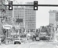  ??  ?? Normally one of the busiest in Orlando, the intersecti­on on Internatio­nal Drive at Sand Lake Road is nearly deserted on April 6.