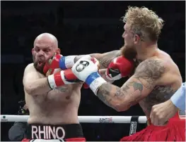  ?? AL BELLO/GETTY IMAGES VIA AGENCE FRANCE-PRESSE ?? SINUNTOK ni Jake Paul si Ryan Bourland sa kanilang laban sa cruiserwei­ght sa Coliseo de Puerto Rico sa Hato Rey, Puerto Rico noong Marso 2, 2024.