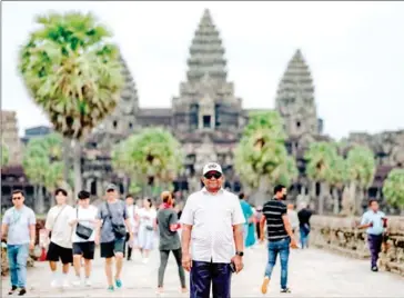  ?? UN IN CAMBODIA ?? UN General Assembly President Abdulla Shahid visits Angkor Wat temple on August 21.