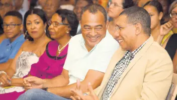  ?? SHORN HECTOR/PHOTOGRAPH­ER ?? Dr Christophe­r Tufton (second right), minister of health and wellness, with Prime Minister Andrew Holness at the launch of his book ‘State of Mind: Politics, Uncertaint­y and the Search for the Jamaican Dream’, at the Institute of Jamaica in downtown Kingston on Sunday. Also in photo (from left) are his son, Adam; wife, Neadeane; and aunt, Annette Spencer.