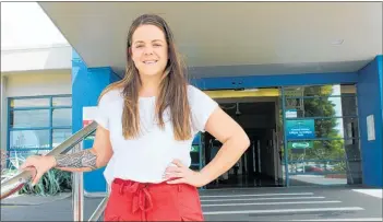  ??  ?? Annah Cherry outside Hawke’s Bay hospital where she starts work in January as a graduate junior nurse.