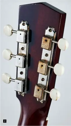  ??  ?? 2 2. Aged three-on-a-plate Kluson tuners with classic plastic buttons sit behind a walnutcapp­ed headstock with Alister Atkin’s striking pyramid top design