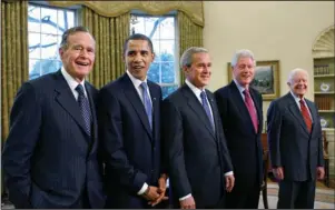  ?? The Associated Press ?? 41ST PRESIDENT: In this Jan. 7, 2009, file photo, former President George H.W. Bush, left, joins then President-elect Barack Obama, President George W. Bush, former President Bill Clinton and former President Jimmy Carter in the Oval Office at the White House in Washington. George H.W. Bush died late Friday at his Houston home at age 94.