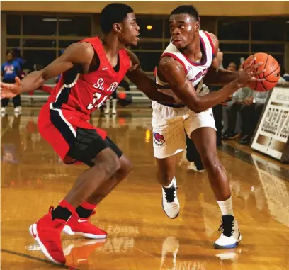  ?? | ALLEN CUNNINGHAM/ FOR THE SUN- TIMES ?? Curie’s Jayden Gasby ( right) looks to pass around St. Rita defender Javon Cooley on Sunday.