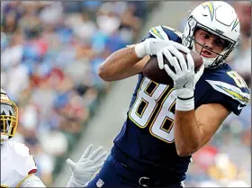  ?? AP/ALEX GALLARDO ?? Los Angeles Chargers tight end Hunter Henry, who played collegiate­ly at Arkansas and in high school at Pulaski Academy, has practiced with the Chargers and could be available for Sunday’s wild-card playoff game against the Baltimore Ravens. Henry tore the anterior cruciate ligament in his right knee during an offseason workout and has not played this season.