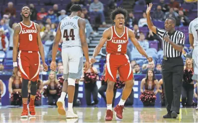  ?? BILLY HURST/USA TODAY SPORTS ?? Collin Sexton, above, kept Alabama’s SEC and NCAA tournament hopes alive with a buzzer-beater Thursday vs. Texas A&M in a 71-70 win.