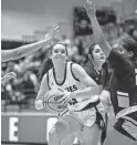  ?? DIANNIE CHAVEZ/THE REPUBLIC ?? Hamilton’s Savanna Creal prepares to shoot the ball against Dobson at Hamilton High School Dec. 11 in Chandler.