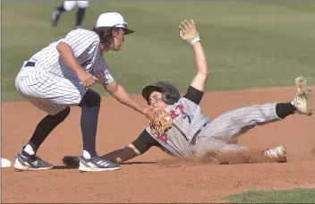  ?? Dan Watson/The Signal of the ?? Reagan Meyer (7) of Hart is tagged out at second base by Jake Callahan (3) for the second out second inning at West Ranch during an earlier matchup this season.