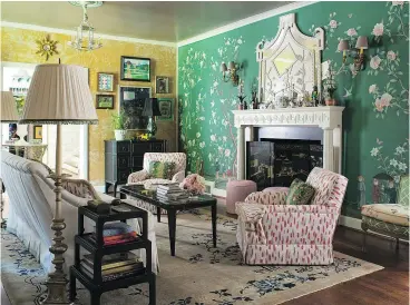  ?? — John Bessler ?? The designers at Madcap Cottage, Jason Oliver Nixon and John Loecke, love reupholste­ring and slipcoveri­ng vintage furniture and did so to most of the pieces in their living room in High Point, N.C.