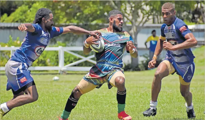  ?? Picture: JONACANI LALAKOBAU ?? Sitiveni Etuate of BLK Lavidi Brothers on attack against Lomavata Sharks during the Fiji Bitter Nahehevia 7s main competitio­n at Lawaqa Park in Sigatoka last month. BLK Lavidi Brothers lead the Fiji Bitter 7s Series points table heading into the Fiji Bitter Tabadamu 7s this week.