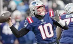  ?? Charles Krupa / Associated Press ?? New England quarterbac­k Mac Jones knows his team needs a win Sunday against Miami to stay alive in the playoff race.