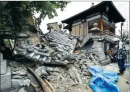  ?? NEWS AGENCY / REUTERS KYODO ?? Damage to Myotoku-ji temple caused by the earthquake is seen in Ibaraki, in western Japan’s Osaka prefecture, on Monday.