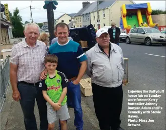  ??  ?? Enjoying the Ballyduff horse fair on Sunday were former Kerry footballer Johnny Bunyan,Adam and Pa Kennelly with Stevie Hayes.
Photo: Moss Joe Browne.