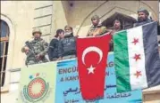  ?? AP ?? ▪ The flags of Turkey and Ankaraback­ed Free Syrian Army in the city centre of Afrin in northern Syria on Sunday.
