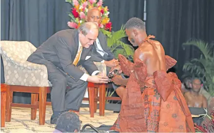  ?? Photo: Office of Attorney-General ?? Asia-Pacific Broadcasti­ng Union General Secretary Javad Mottagi receives a bowl of yaqona from a young man from the vanua of Nadi who performed the official traditiona­l welcome ceremony at the 4th Asia Pacific (ABU) Media Summit on Climate Change and...