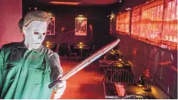  ?? ?? Owner Cameron Markham said his love of ‘80s horror movies inspired the decor and menu items at Blood Sausage located in the Bricklight District south of the University of New Mexico.