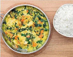 ??  ?? Delicious coconut fish curry with jasmine rice.