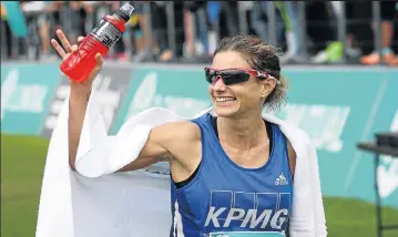  ?? Pictures: ESA ALEXANDER ?? GALLOPING MOM: Caroline Wostmann, above, defended her Two Oceans Marathon crown yesterday while Zimbabwean Mike Fokoroni took the men’s title to record his maiden victory in a major race
