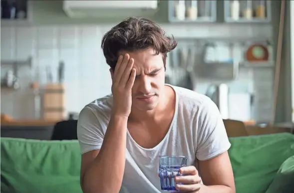  ?? GETTY IMAGES ?? Hangover symptoms can be exacerbate­d when combined with feelings of anxiety over what happened during the drinking binge, in a portmantea­u condition known as “hangxiety.”