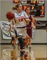  ?? Cory Rubin/The Signal (See additional photos on signalscv.com) ?? (Above) Santa Clarita Christian’s Kelly Lotz (12) looks to make a pass in a matchup with de Toledo High School. (Below) Emily Bernards (23) drives into the lane at SCCS Monday night.