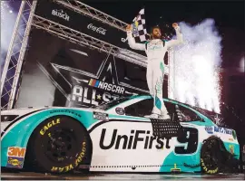  ?? JARED C. TILTON — GETTY IMAGES ?? Chase Elliott celebrates in Victory Lane after claiming NASCAR’s All-Star race at Bristol Motor Speedway on Wednesday night. Elliott joins his father as a winner of the race.