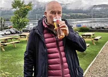  ??  ?? Drew Carter conquered 15 pubs for the ultimate tour, pictured in Brodick, Arran