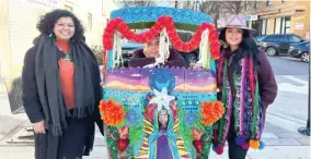  ?? EMMANUEL CAMARILLO/SUN-TIMES ?? Carolina Juarez, Fausto Lopez and Jessica Juarez pose in front of their Tuk Tuk sculpture at Talman and Devon avenues. Their sculpture pays tribute to the Juarez sisters’ home country, Guatemala.