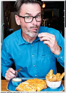  ??  ?? DEEP-FRIED FEAST: Richard Rayner tucks into one of his three parmos