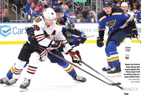  ?? DILIP VISHWANAT/ GETTY IMAGES ?? Hawks star Patrick Kane (shown this season against the Blues) says it will be weird to play in a game without fans.