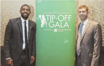  ?? STAFF PHOTO BY NICOLAUS CZARNECKI ?? HOLDING COURT: Newest Celtic Kyrie Irving and coach Brad Stevens are all smiles at the Celtics Shamrock Foundation annual Tip-Off Gala last night at the Westin Boston Waterfront.