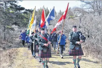  ?? FRAM DINSHAW/ THE NEWS ?? Guests march toward the cairn commemorat­ing the Battle of Culloden in Knoydart on Saturday afternoon.