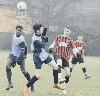  ??  ?? Action from the League Cup semi-final between Gunthorpe Harriers Navy Under 18s and Yaxley.