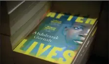  ?? Leon Neal / Getty Images ?? In this photo illustrati­on, copies of “After Lives” by the winner of the 2021 Nobel Prize for Literature Abdulrazak Gurnah are seen in a bookstore on Thursday in London.