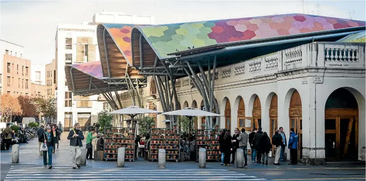  ??  ?? Santa Caterina market on a sunny day in Barcelona, Spain.