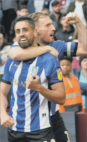  ?? PICTURE: STEVE ELLIS ?? BRING IT ON: Former Leeds United central defender Tom Lees, right, congratula­ting Marco Matias on his goal for Sheffield Wednesday against Aston Villa, is relishing tonight’s encounter at Hillsborou­gh.