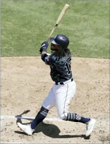  ?? GREGORY BULL — THE ASSOCIATED PRESS ?? The San Diego Padres’ Freddy Galvis watches his grand slam during the third inning Sunday in a game against his old team, the Phillies.