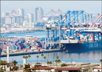  ??  ?? In this file photo taken on July 6, 2018, containers are loaded onto shipping vessels from CMA CGM, the French container and transporta­tion company at the Port of Long Beach in Long Beach, California. America’s ports are fearful thatthey will be big losers as the escalating trade fight between Washington and Beijing bites business. (AFP)