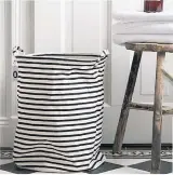  ??  ?? Now there’s no excuse for dropping dirty clothes on the bedroom floor. Large monochrome stripe laundry basket £16.50, Not On The High Street
