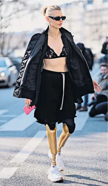  ?? ?? Stepping out: Lauren Wasser on the runway for Louis Vuitton this week, top right, and with her mother, model Pamela Cook, top left