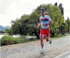  ?? KAI SCHWOERER/GETTY IMAGES ?? Javier Gomez on his way to winning the middle-distance triathlon at Challenge Wanaka.