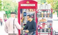  ?? Pictures / Bloomberg ?? Umar Khalid had to scour the internet to find refrigerat­ion, shelving and espresso equipment that would fit inside his telephone box.
