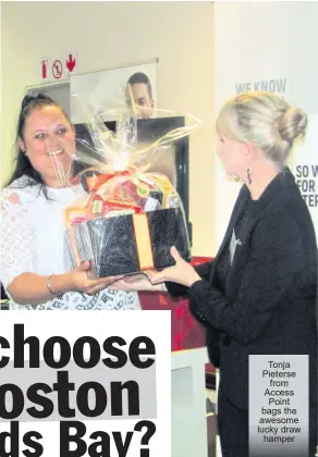  ?? ?? Tonja Pieterse from Access Point bags the awesome lucky draw hamper