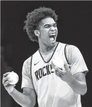  ?? ?? The Rockets’ Josh Christophe­r tries to hype up fans before tossing a souvenir ball into the crowd.