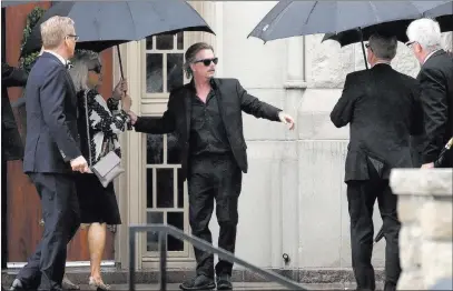  ?? Orlin Wagner ?? The Associated Press Actor-comedian David Spade helps family members enter Our Lady of Perpetual Help Redemptori­st Catholic Church for funeral services Thursday for his sister-in-law, designer Kate Spade, in Kansas City, Mo.