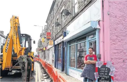  ??  ?? This was Nolton Street in September 2013 and soon the diggers will be back, a move which has angered traders. Pictured is Steve Bletsoe of Ella Riley’s traditiona­l sweet shop