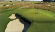  ?? THE ASSOCIATED PRESS FILE ?? A grounds crew worker places the pin on the seventh green at Shinnecock Hills Golf Club in Southampto­n, N.Y. The 2018 U.S. Open returns to Shinnecock Hills for the fifth time.