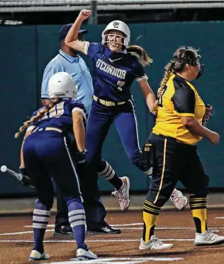  ?? Photos by Ronald Cortes / Contributo­r ?? O’Connor’s Leighann Goode celebrates after scoring the winning run Friday to help the Panthers eliminate Brennan in the third round of the Class 6A softball playoffs.